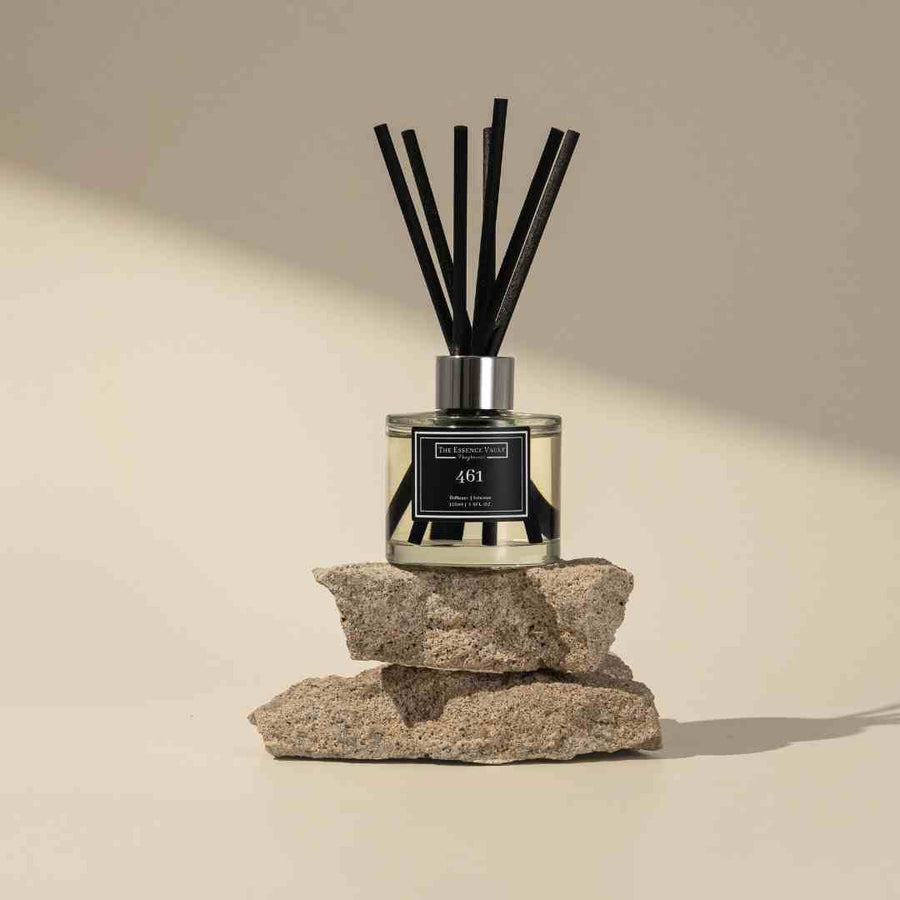 Image of a reed diffuser from the essence vault sat on some aesthetic stones, for the blog post How to Setup a Reed Diffuser