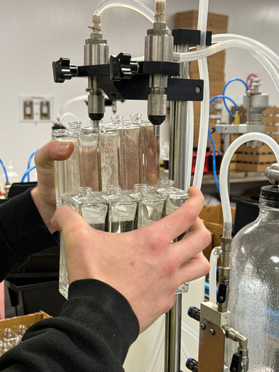 Perfume bottles being filled